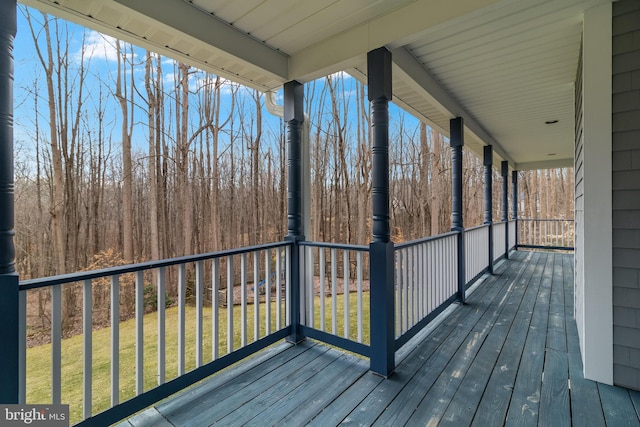 wooden deck with a yard