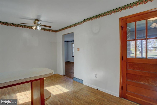 foyer with light wood-type flooring and ceiling fan