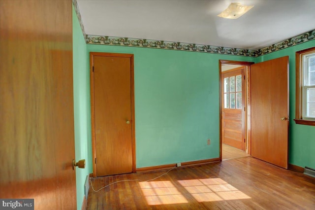 empty room with light hardwood / wood-style floors