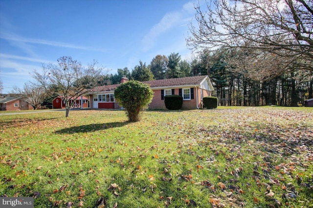 ranch-style home featuring a front yard