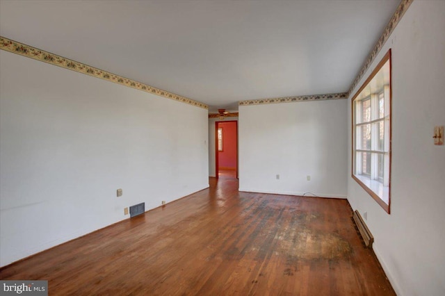 empty room with dark hardwood / wood-style floors