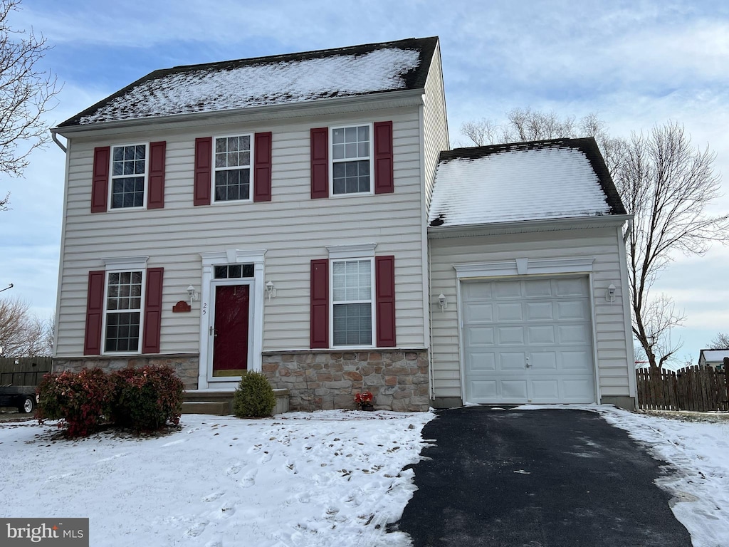 colonial home with a garage