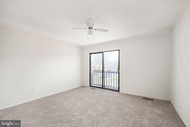 carpeted empty room with ornamental molding and ceiling fan