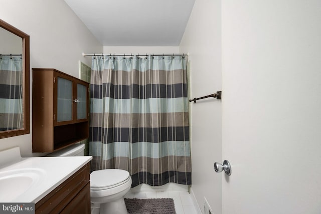 bathroom featuring vanity, tile patterned flooring, toilet, and a shower with shower curtain