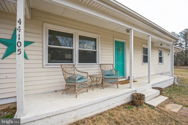 view of exterior entry featuring a porch