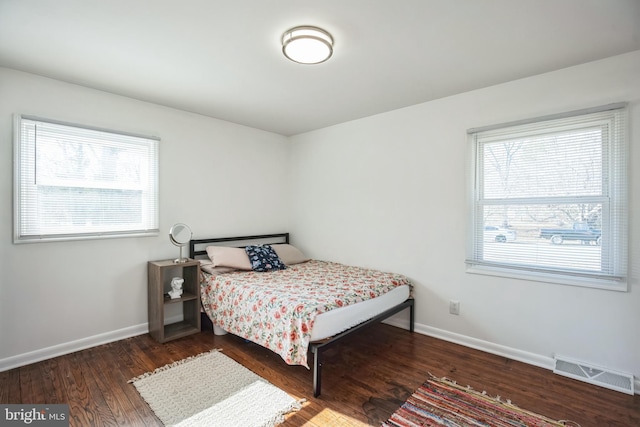 bedroom featuring dark hardwood / wood-style flooring