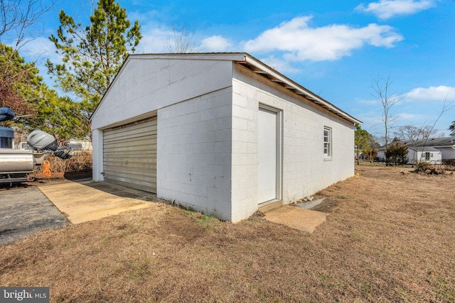 garage featuring a yard