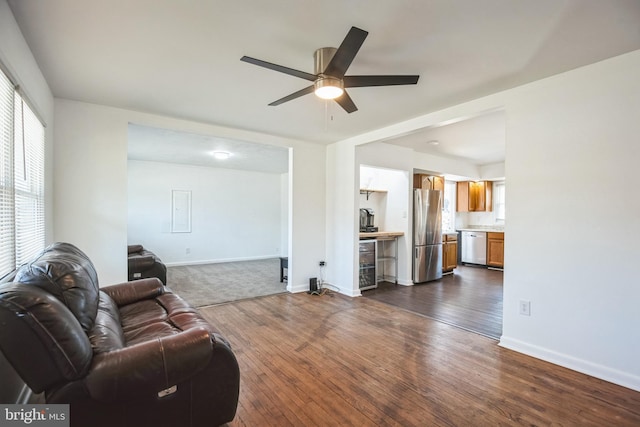 living room with wine cooler, dark hardwood / wood-style floors, and ceiling fan