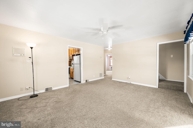 carpeted empty room with ceiling fan