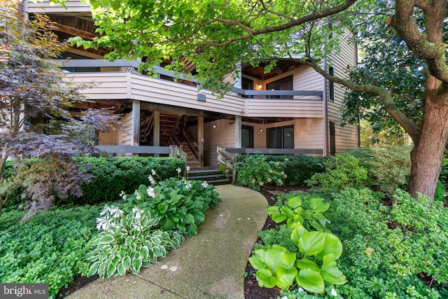 view of front of home with a balcony