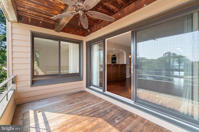 wooden deck with ceiling fan