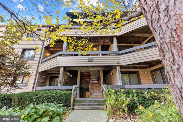 view of front of property with a balcony