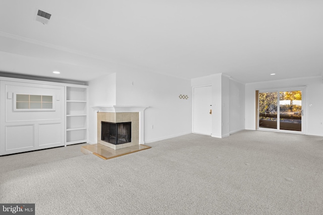 unfurnished living room featuring light carpet and a fireplace