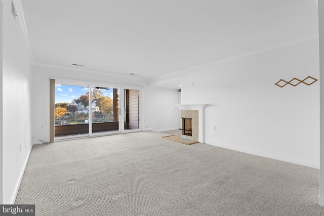 unfurnished living room with light carpet and ornamental molding