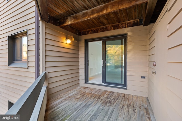 view of exterior entry with a balcony