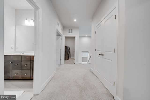 corridor featuring recessed lighting, visible vents, light carpet, and baseboards