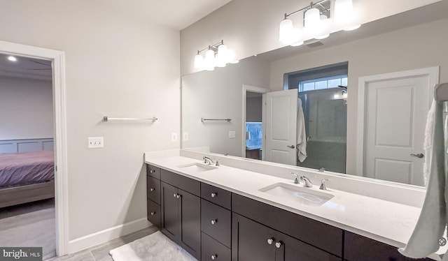 full bathroom with a sink, visible vents, and connected bathroom