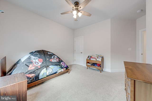 bedroom featuring ceiling fan, carpet flooring, and baseboards