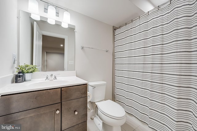 bathroom featuring vanity, toilet, and a shower with curtain