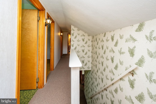 hallway featuring a textured ceiling