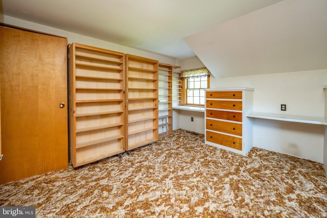 bonus room with carpet flooring and lofted ceiling