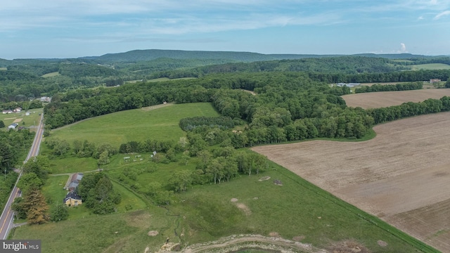 birds eye view of property with a rural view