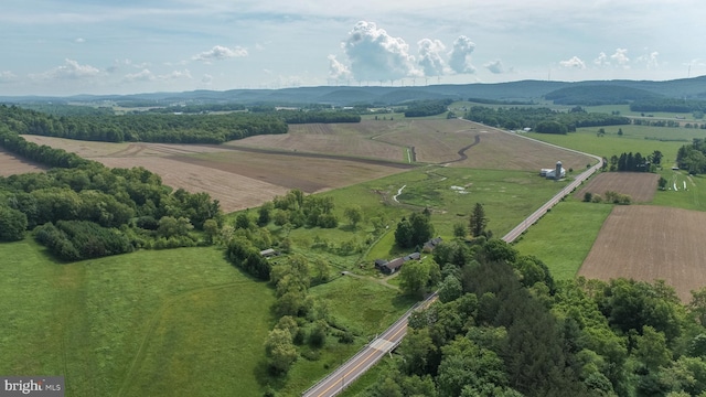 bird's eye view with a mountain view and a rural view