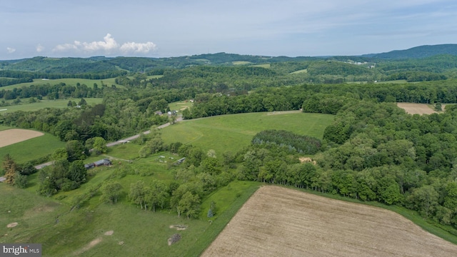 birds eye view of property with a rural view