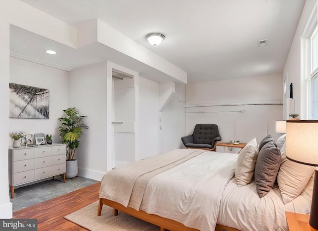 bedroom with hardwood / wood-style flooring