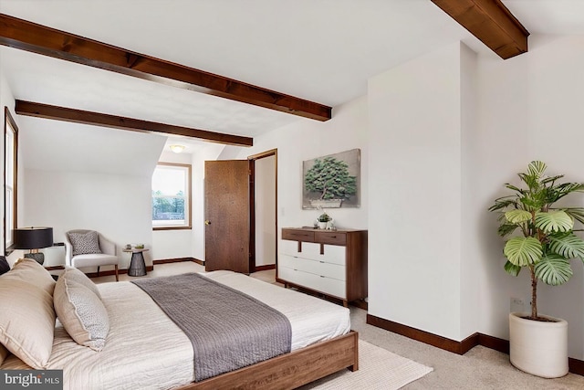 carpeted bedroom with vaulted ceiling with beams