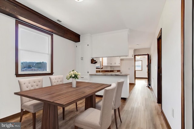 dining area featuring light hardwood / wood-style flooring