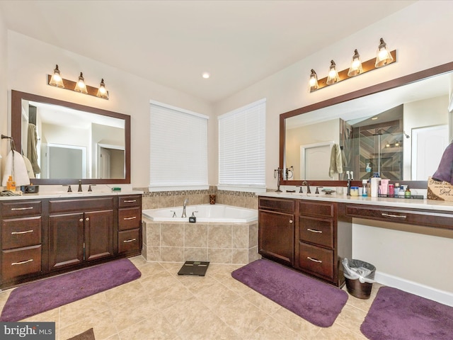 bathroom featuring vanity, tile patterned floors, and independent shower and bath