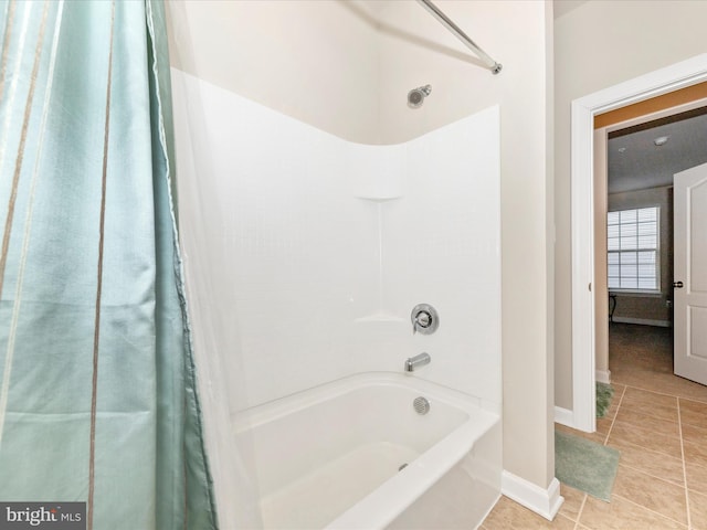 bathroom featuring shower / bath combination with curtain and tile patterned floors