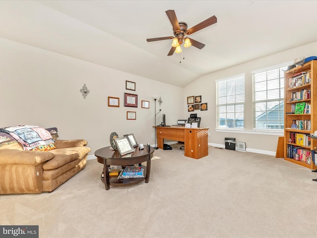 office space featuring ceiling fan, lofted ceiling, and light carpet