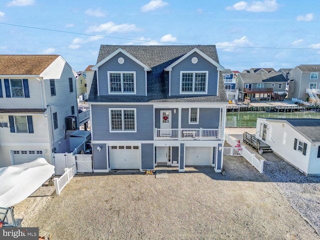 view of front of house featuring a water view and a garage