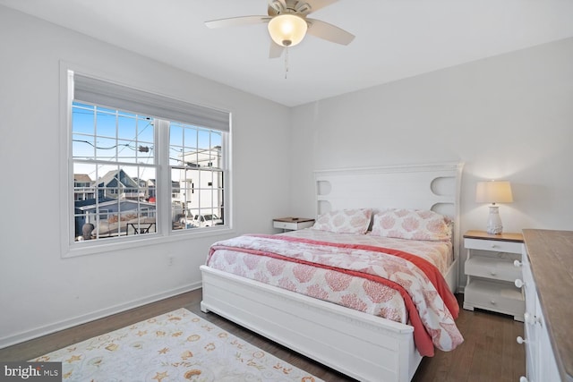 bedroom with ceiling fan and dark hardwood / wood-style floors