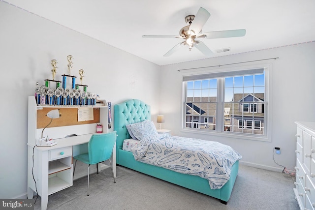 carpeted bedroom featuring ceiling fan