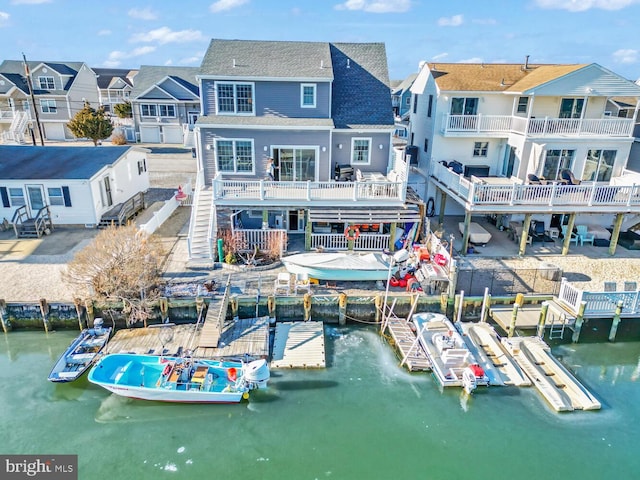 back of house featuring a water view