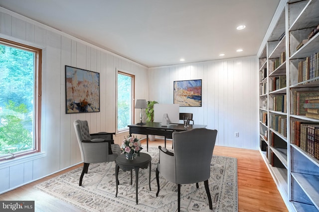 office space featuring hardwood / wood-style floors and crown molding