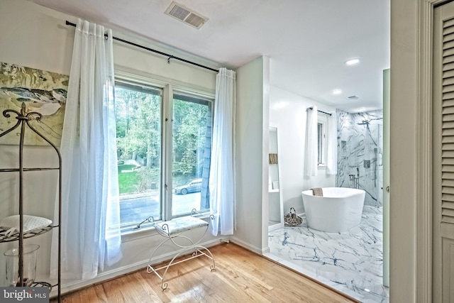 doorway with light hardwood / wood-style floors