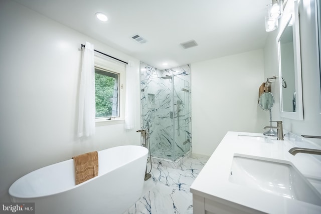 bathroom featuring vanity and shower with separate bathtub