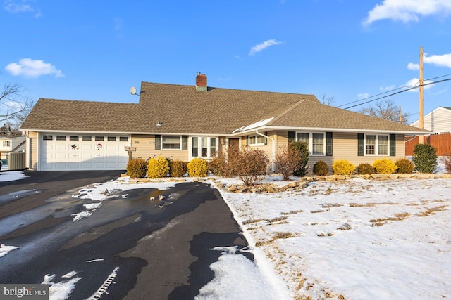 ranch-style home featuring a garage