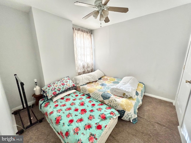 bedroom featuring dark carpet and ceiling fan