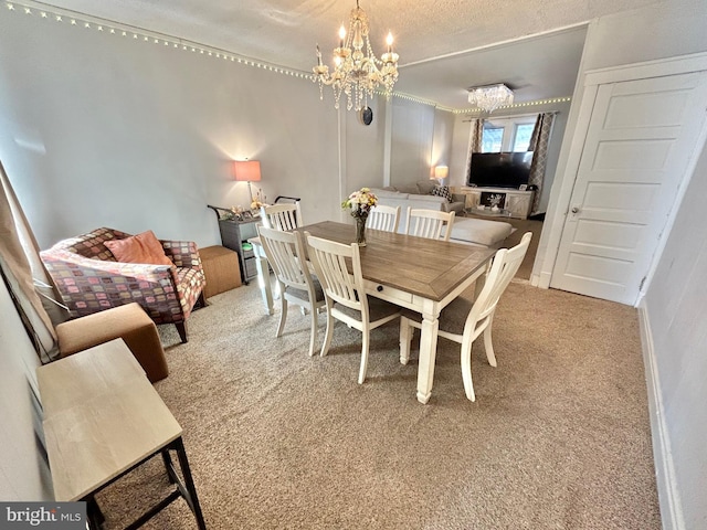 dining area with an inviting chandelier and carpet floors