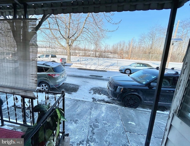 view of snow covered parking