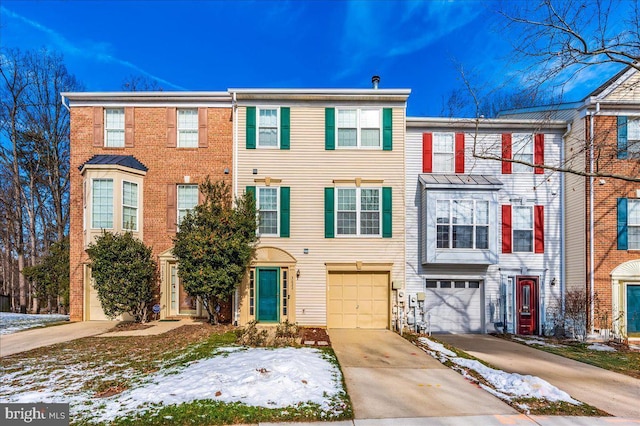 townhome / multi-family property featuring a garage