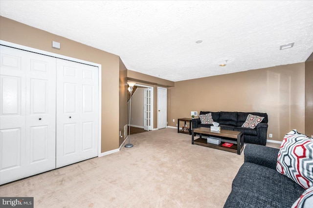 living room with light colored carpet and a textured ceiling