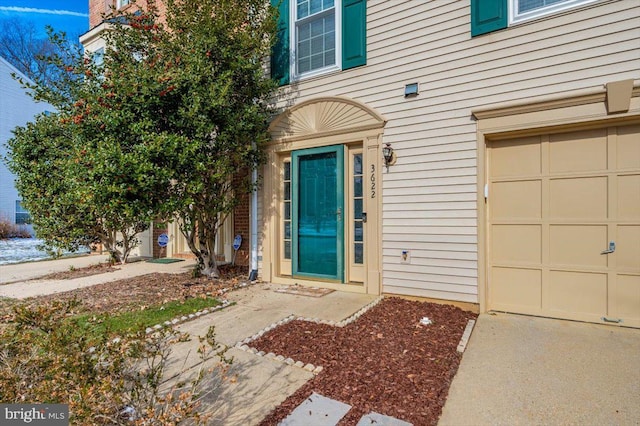 property entrance with a garage