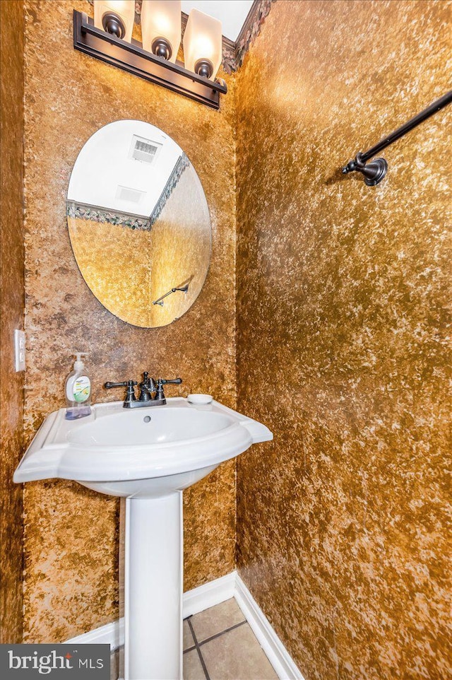 bathroom with tile patterned flooring and sink