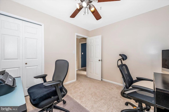 carpeted home office with ceiling fan